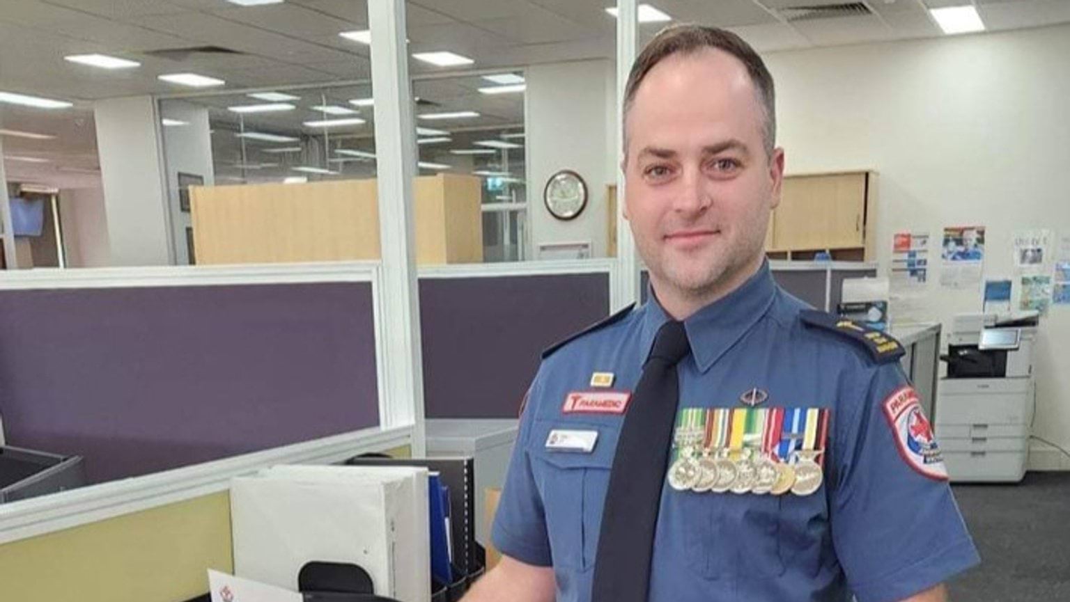 A man in paramedic uniform with war medals.