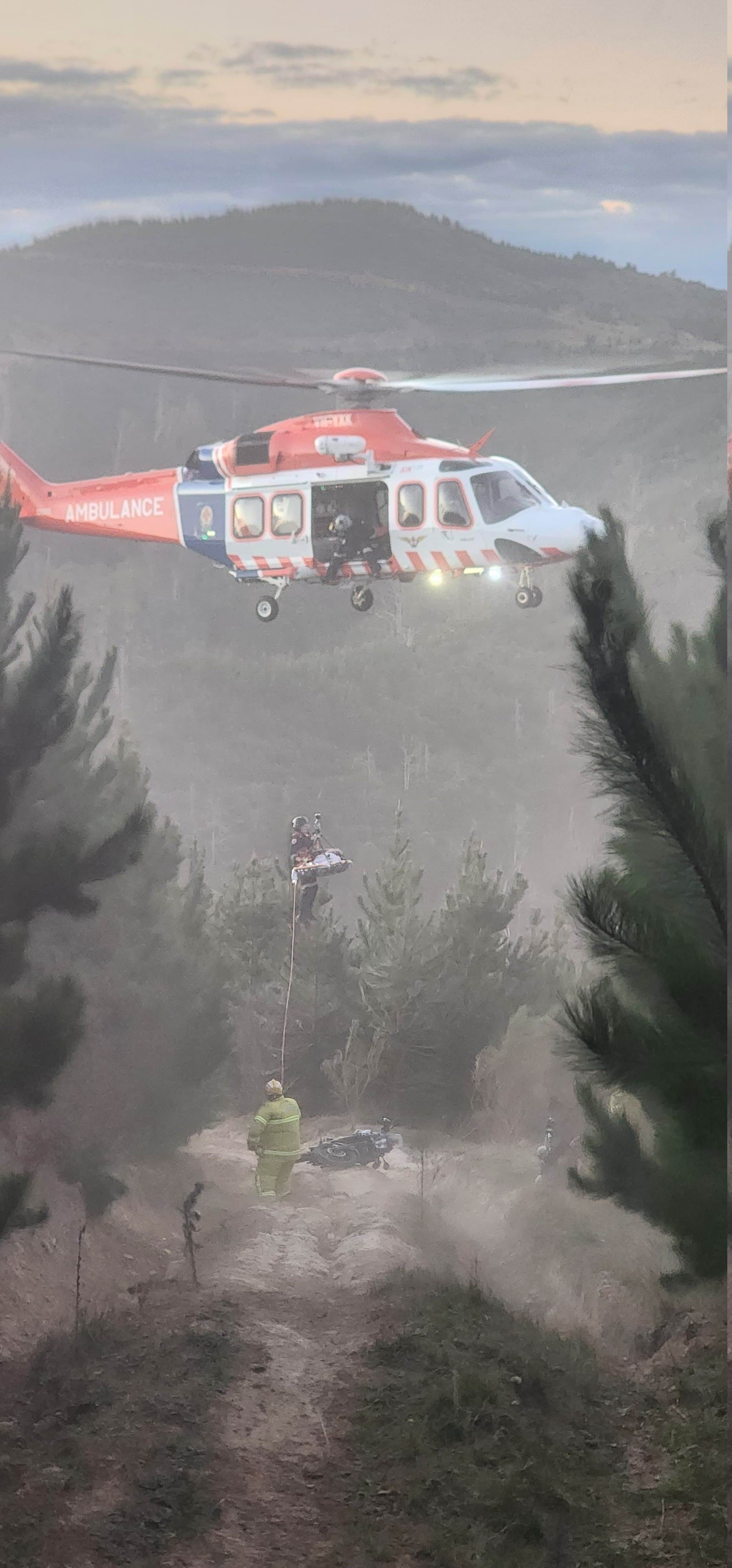 An Air Ambulance is hovering to rescue a patient from the wilderness
