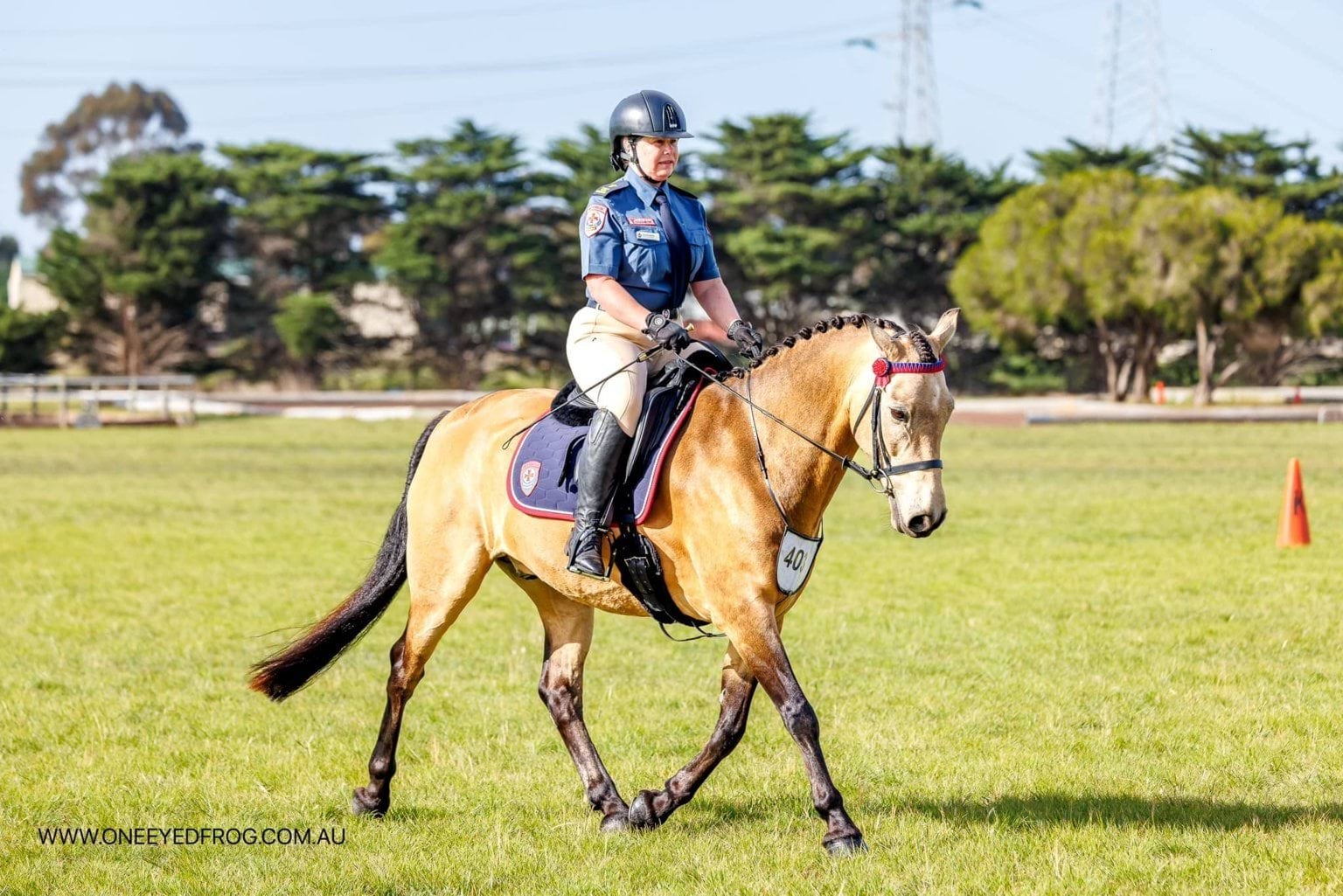 A woman riding a horse.