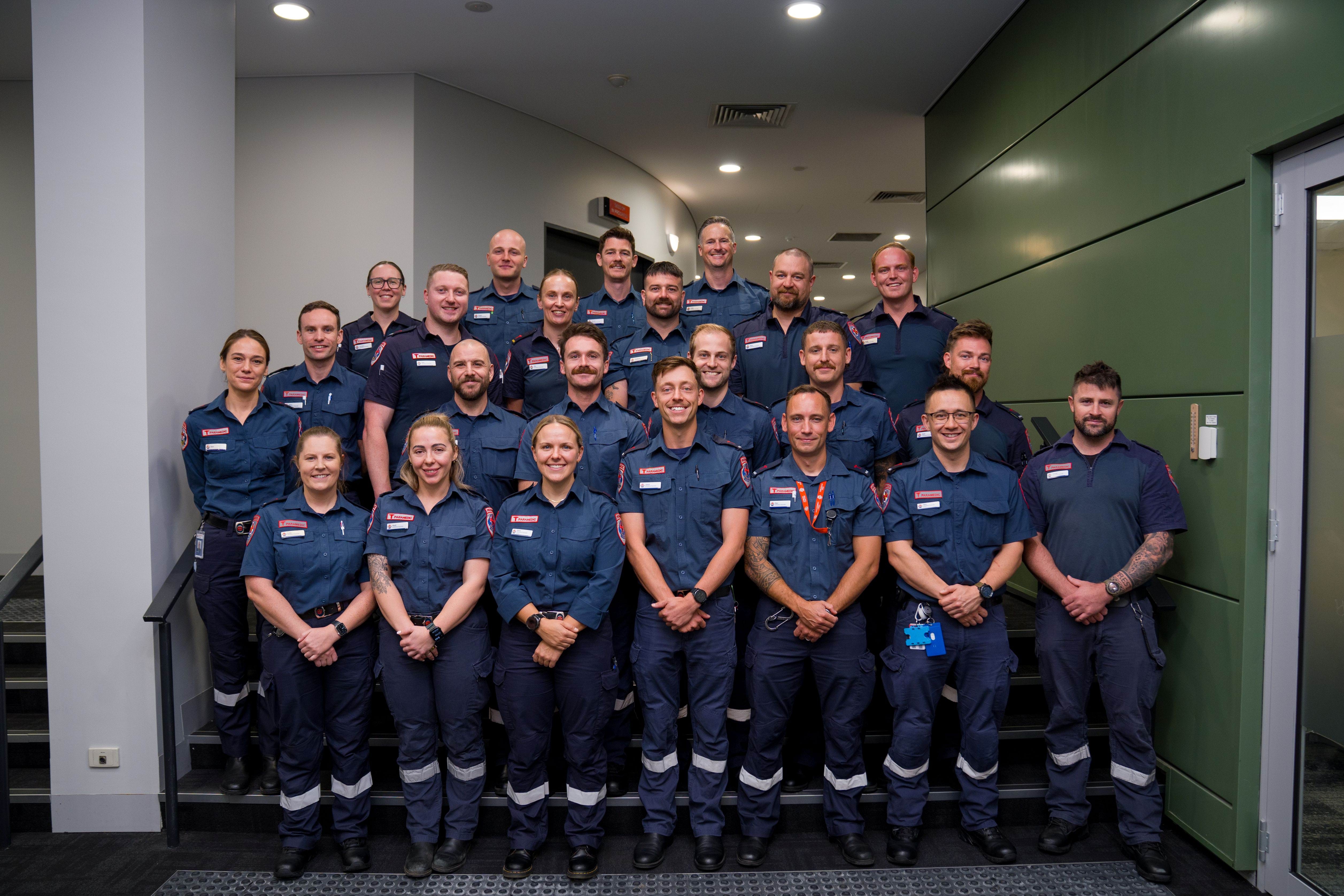 A group photo of people in paramedic uniform.
