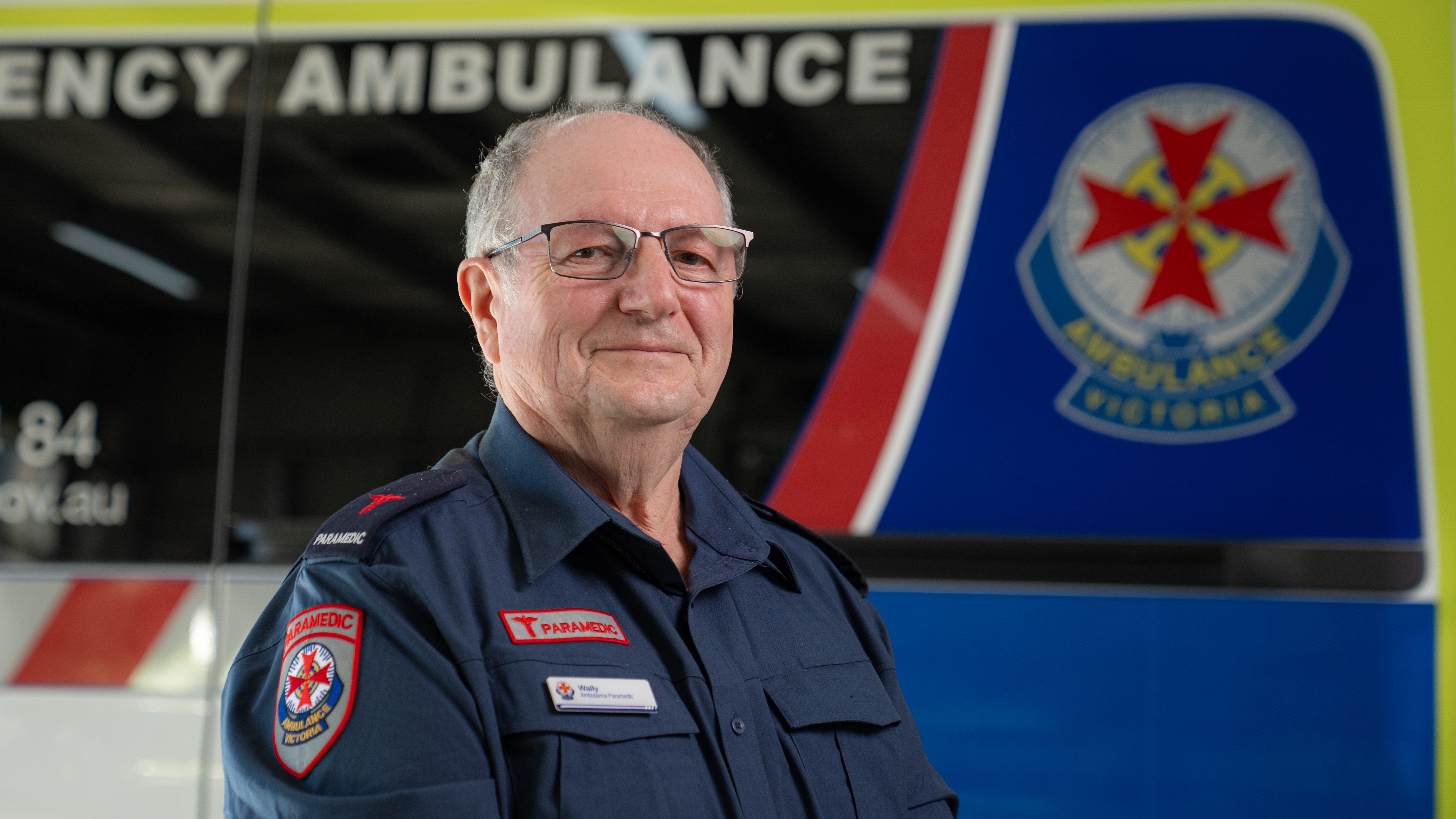 A profile photo of an Ambulance Victoria paramedic in front of an ambulance.