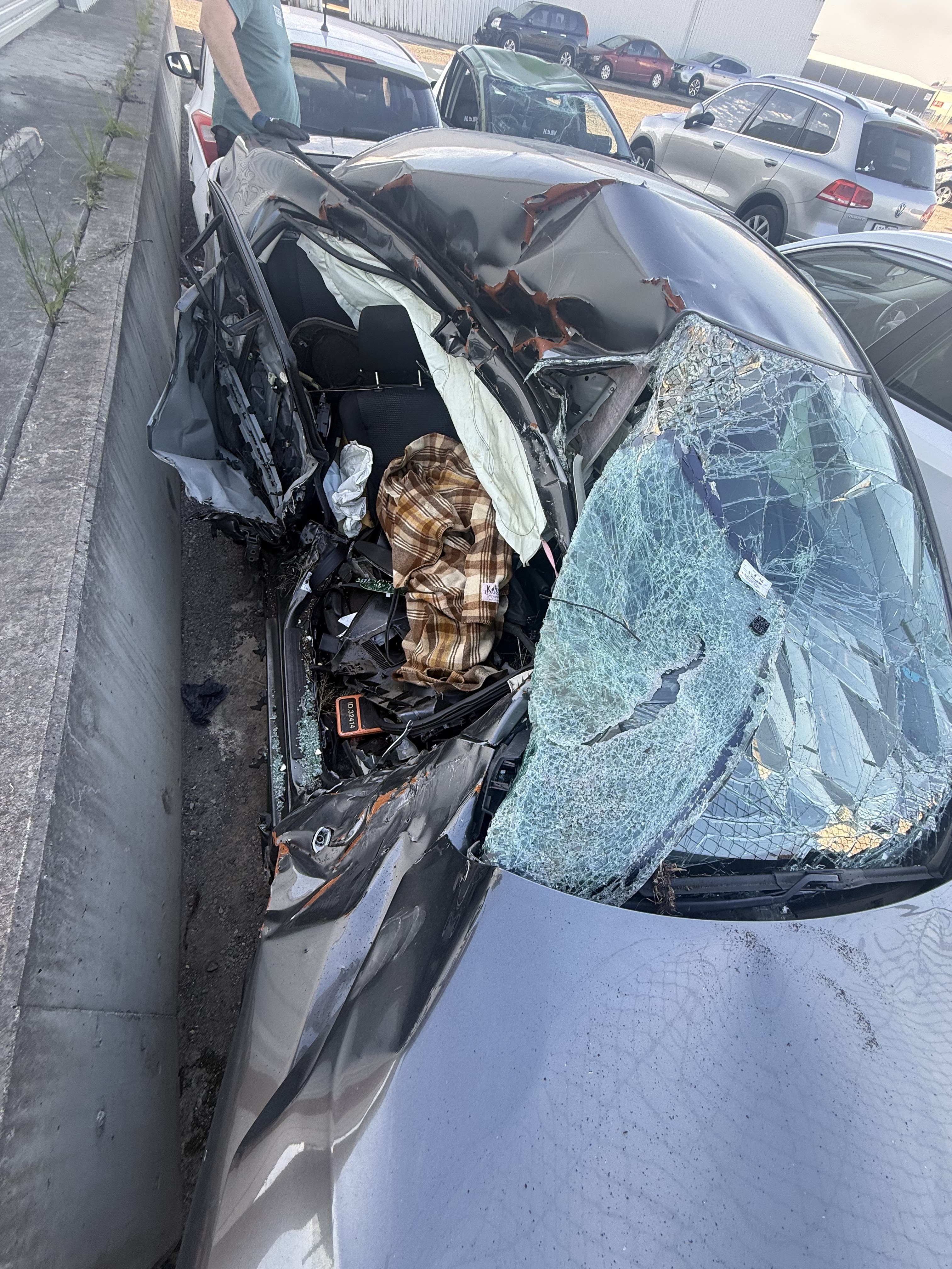 A car crushed on the drivers side.