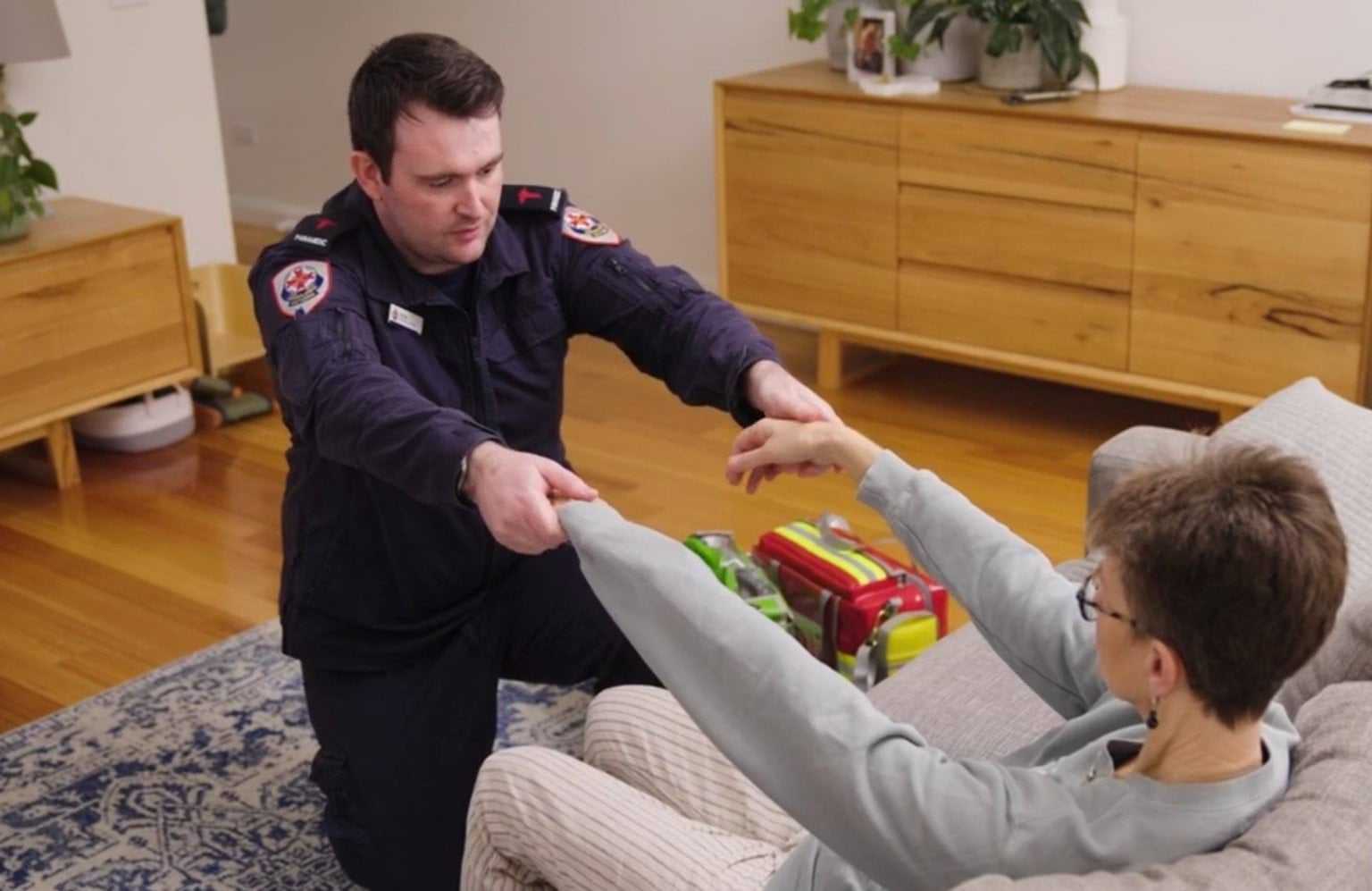 A paramedic checks a potential stroke patient