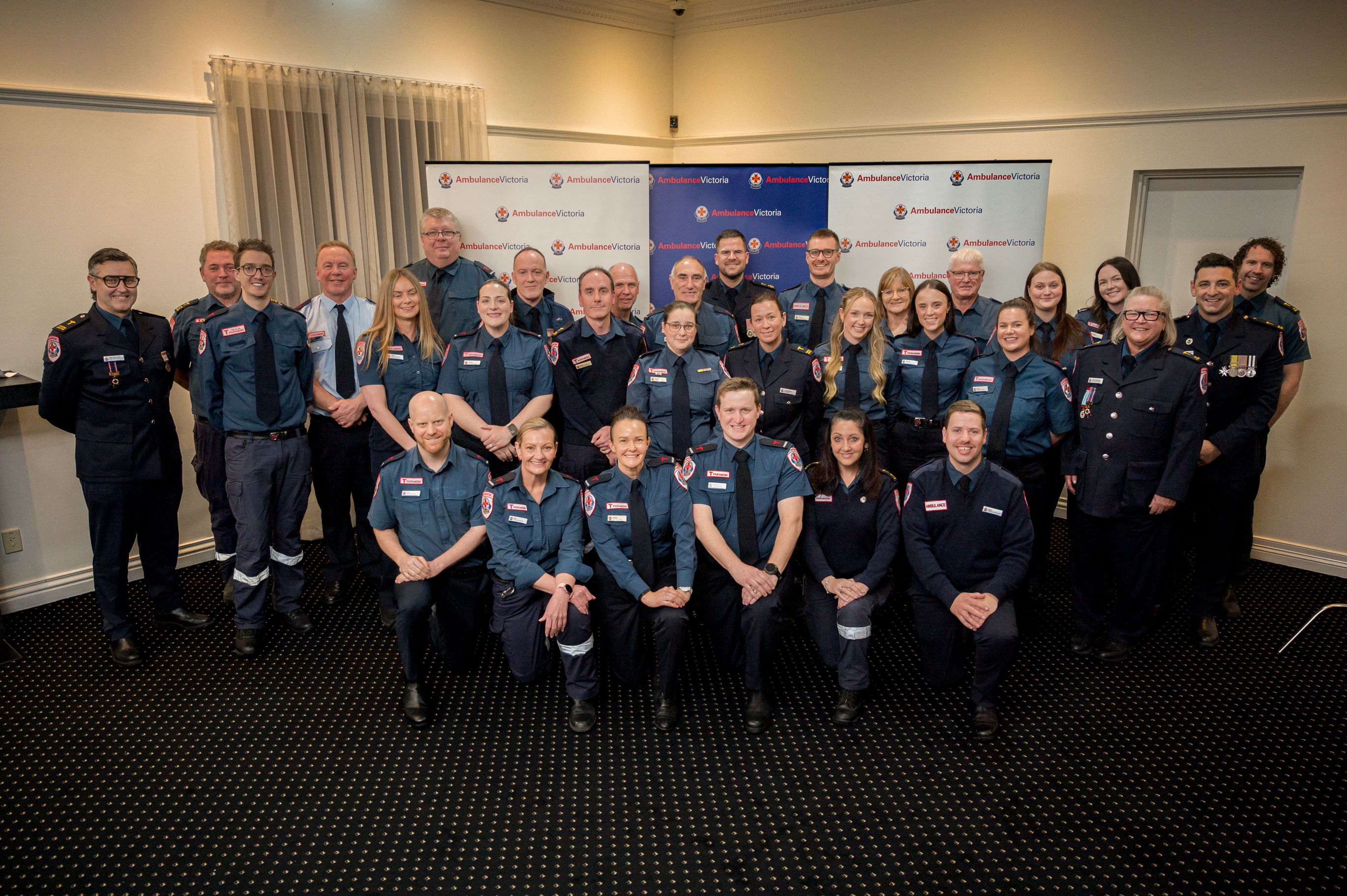 A big group photo at an Ambulance Victoria awards event.