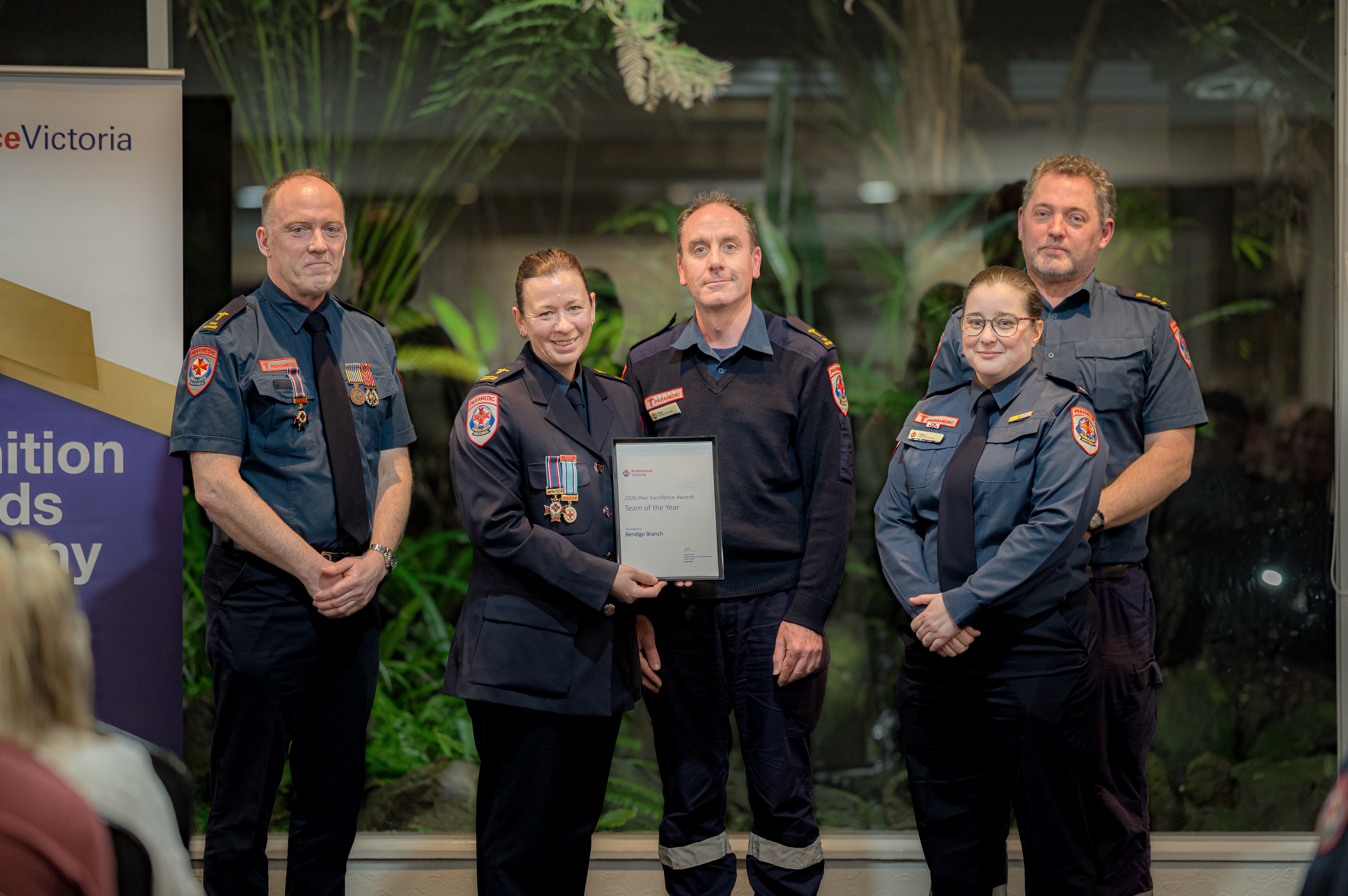 Five paramedics at an awards event.