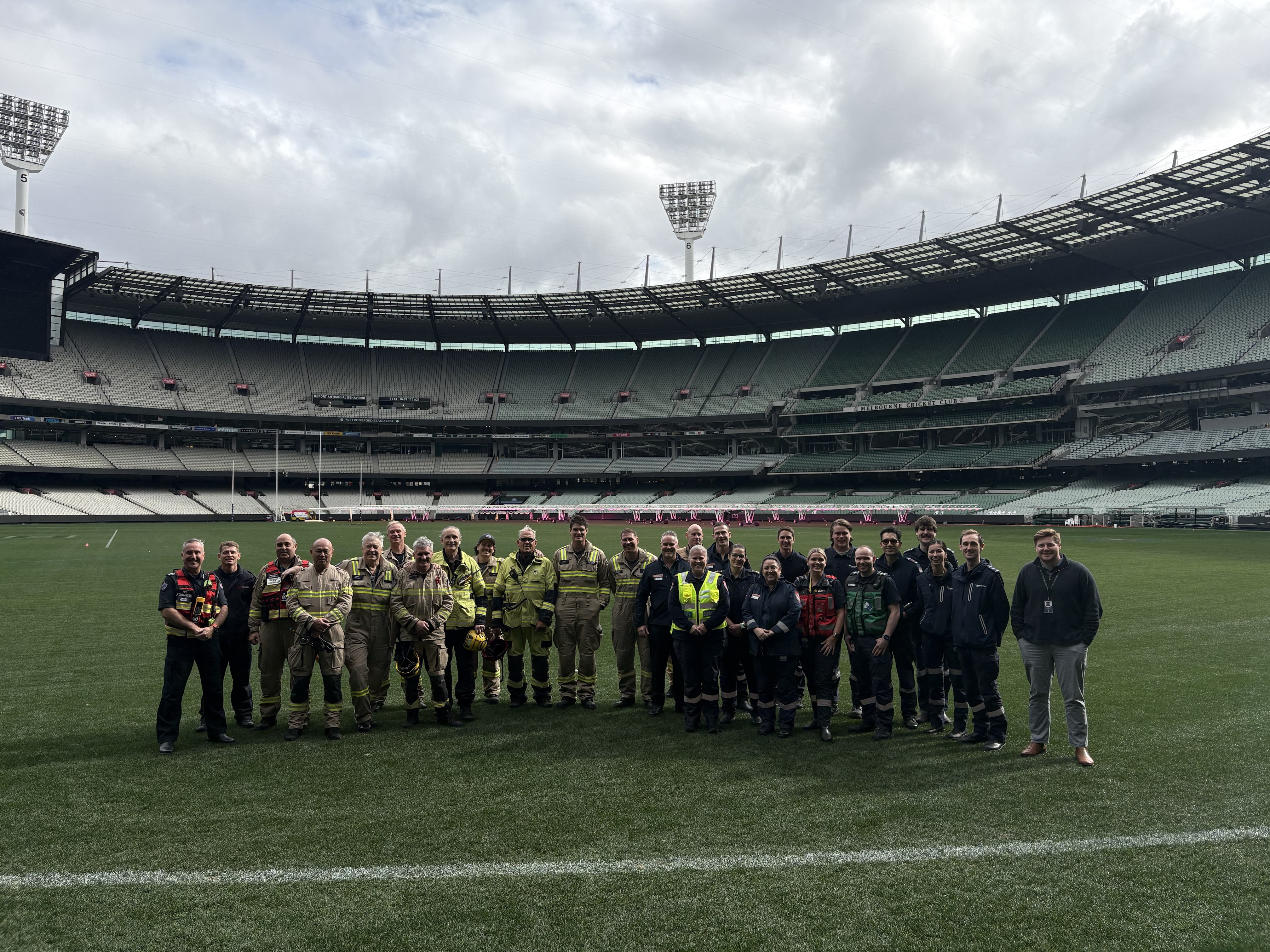 A group photo on the MCG grass.
