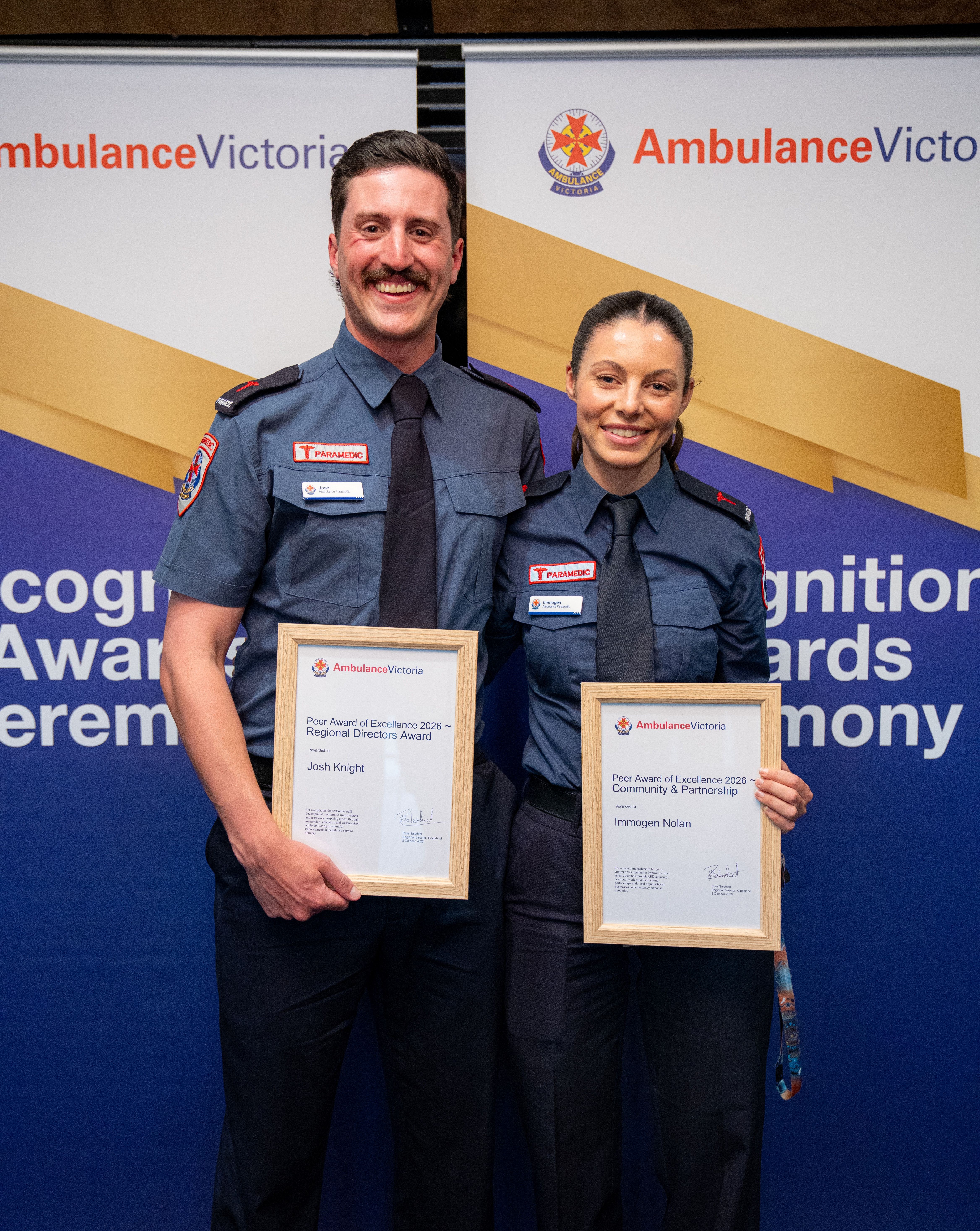A man and woman Ambulance Victoria paramedic with awards.