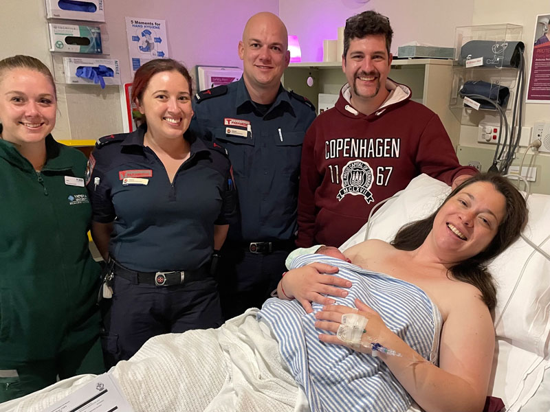 Ambulance Victoria paramedics visiting parents and a newborn baby in hospital