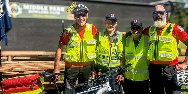 Four paramedics from the bicycle response unit looking at the camera.