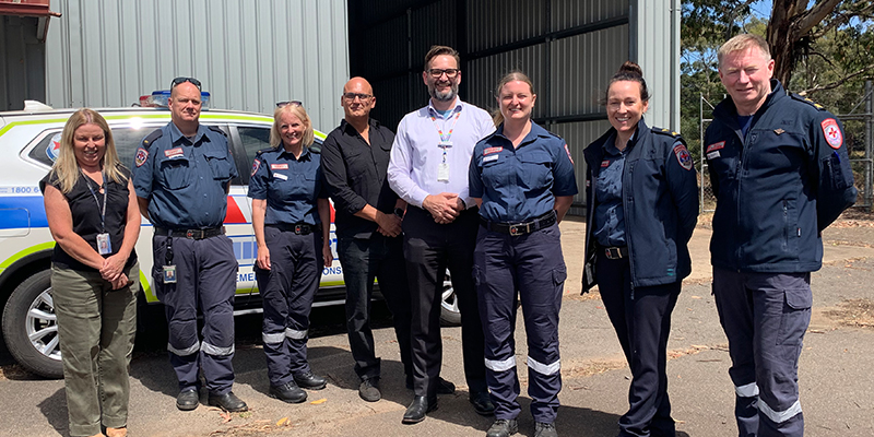 Ambulance Victoria paramedics, CERT volunteers, and property staff standing in front of the new Trentham branch