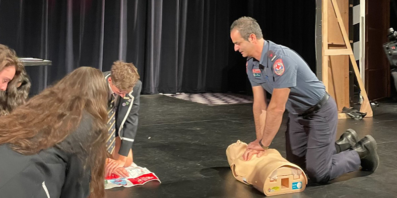 AV Director Research and Evaluation Ziad Nehme teaching CPR to Caulfield Grammar School students