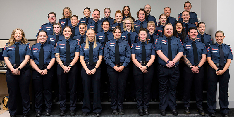 Thirty new paramedic graduates standing for a group shot.