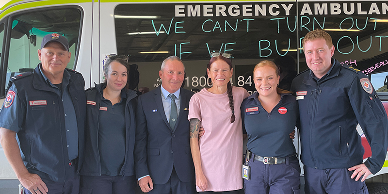 Astrid standing together with the four paramedics and a senior police constable who were at the scene of the accident on that fateful day.