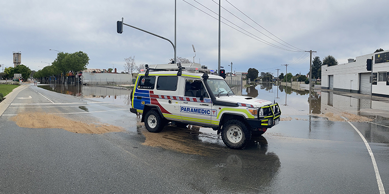 Ambulance Vehicle rescue vehicle parked on a flooded street in Shepparton.